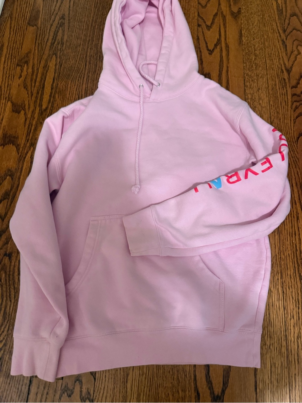 Light Pink Pullover Hoodie with Drawstring and Sleeve Detail ability volleyball
